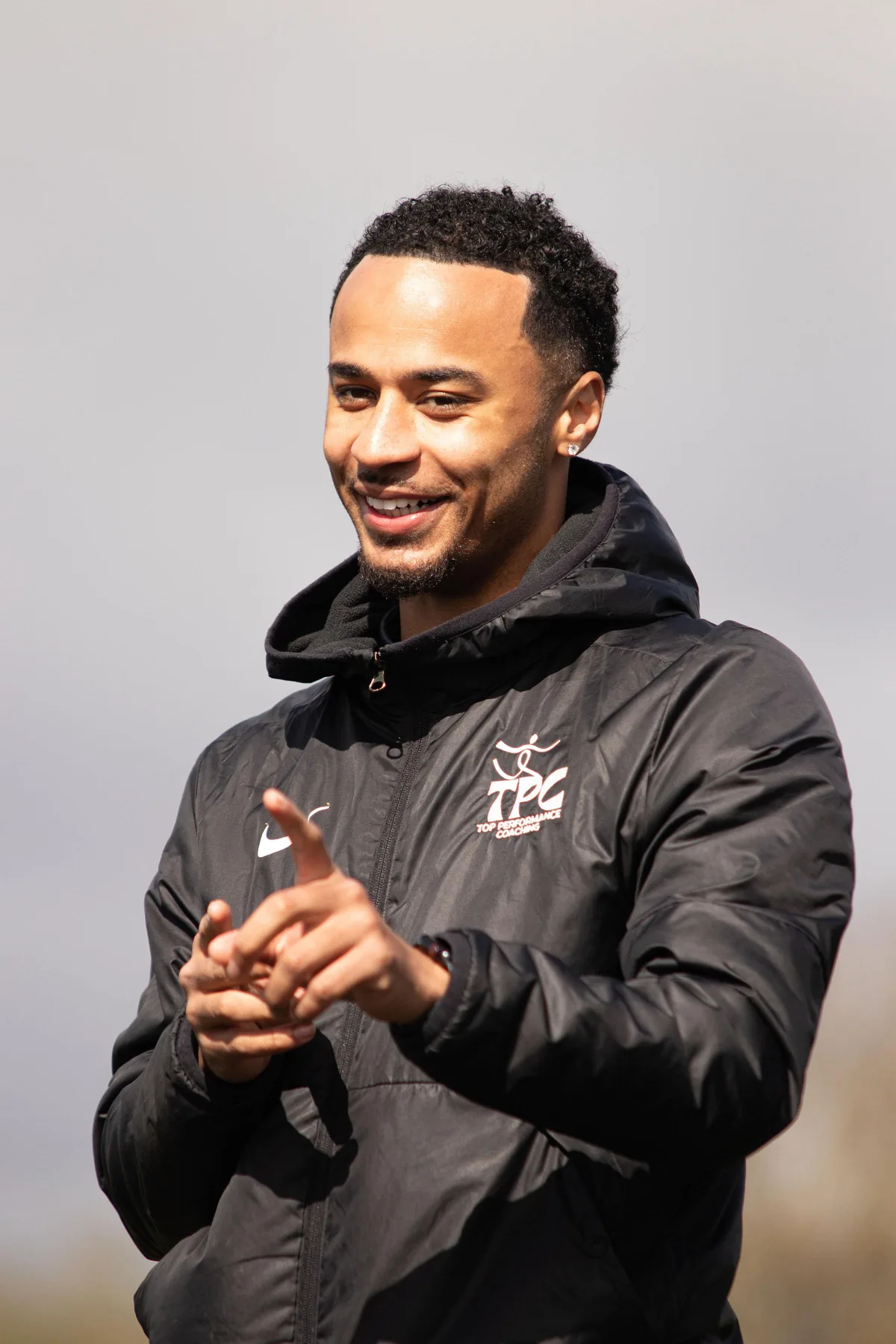 Tyreace Palmer smiling during a coaching session