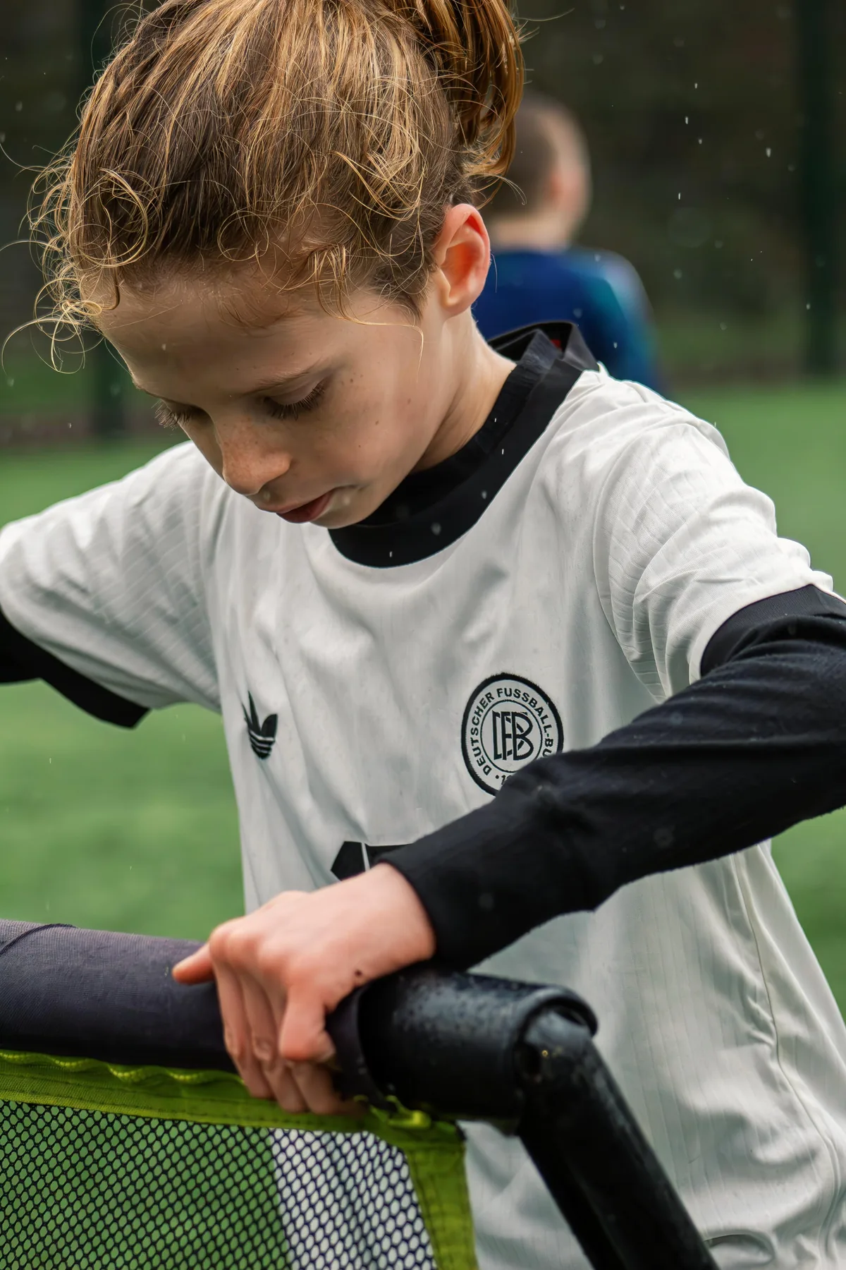Young footballer focused during a drill