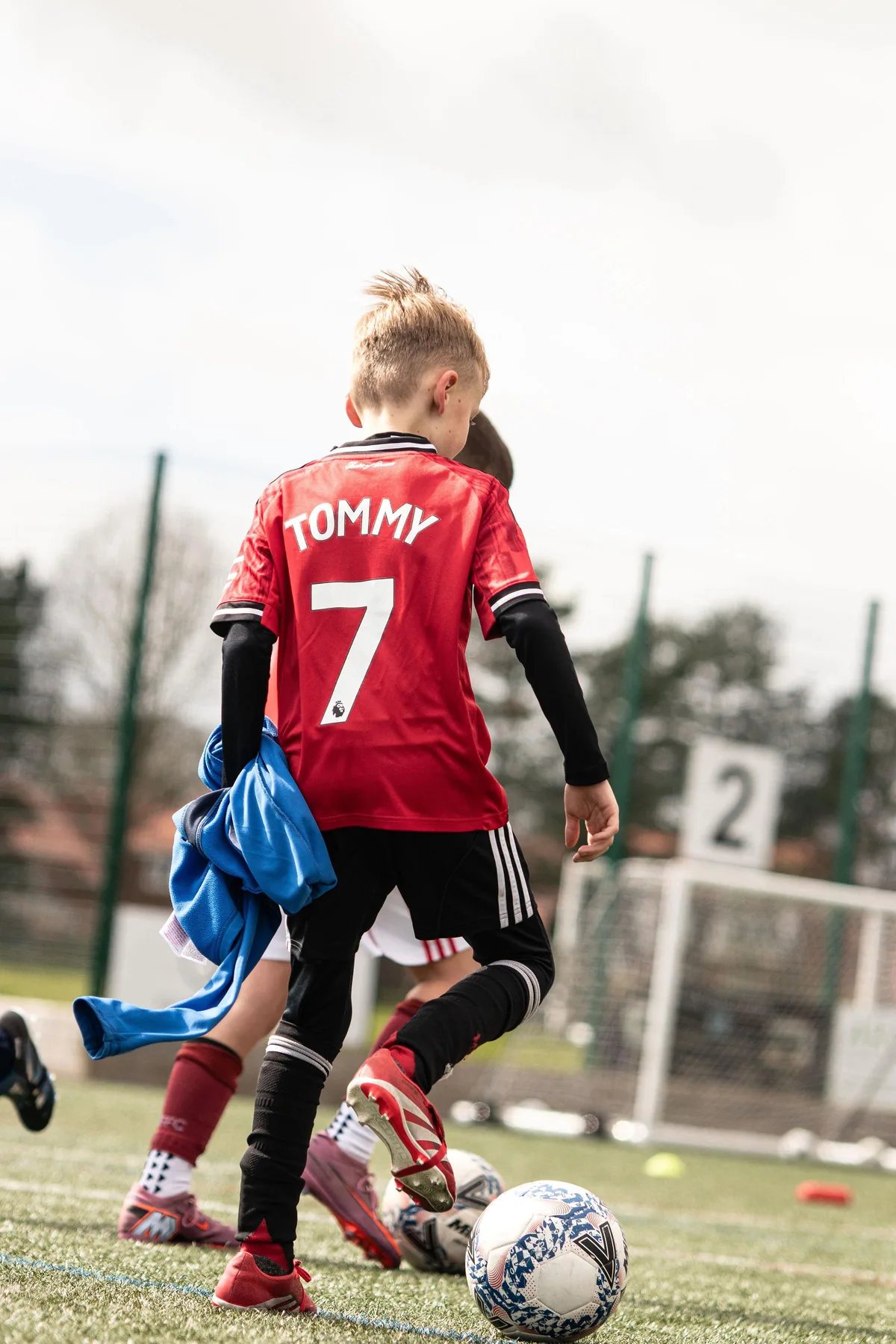 Young player walking onto the football pitch