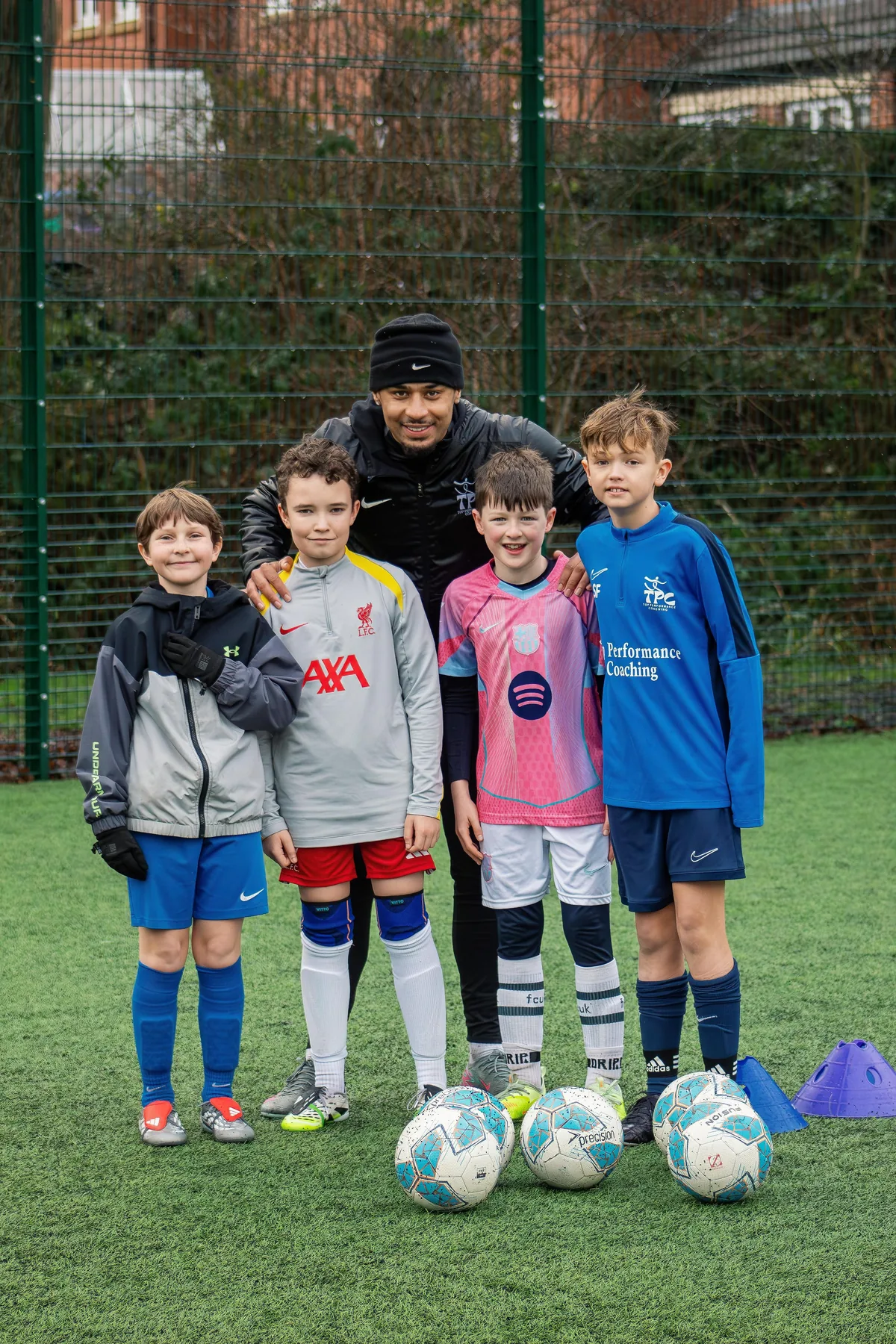 Tyreace with a group of players after training
