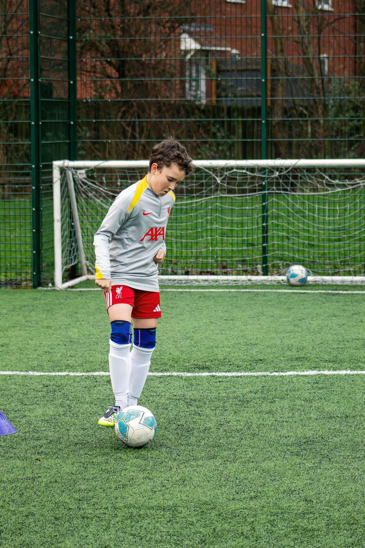 Young player taking a set piece during training