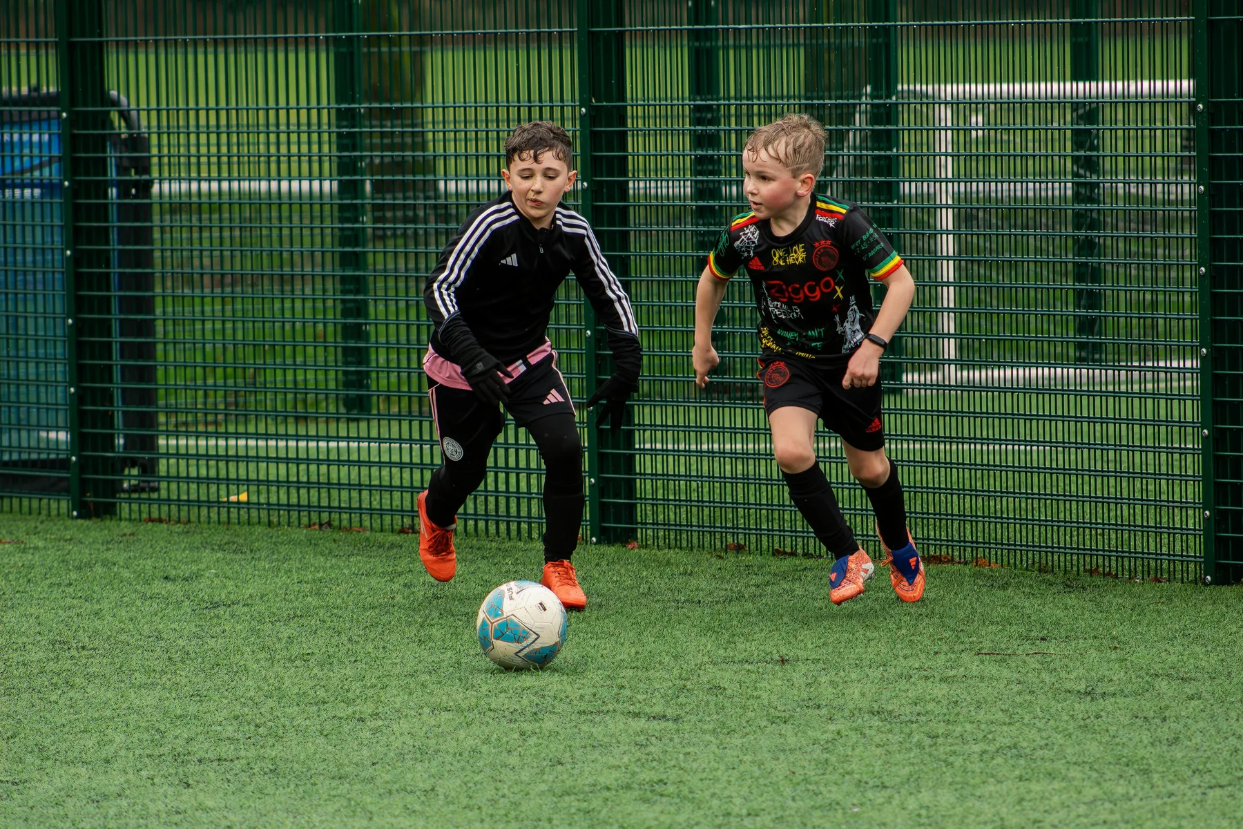 Young footballers in a competitive group drill