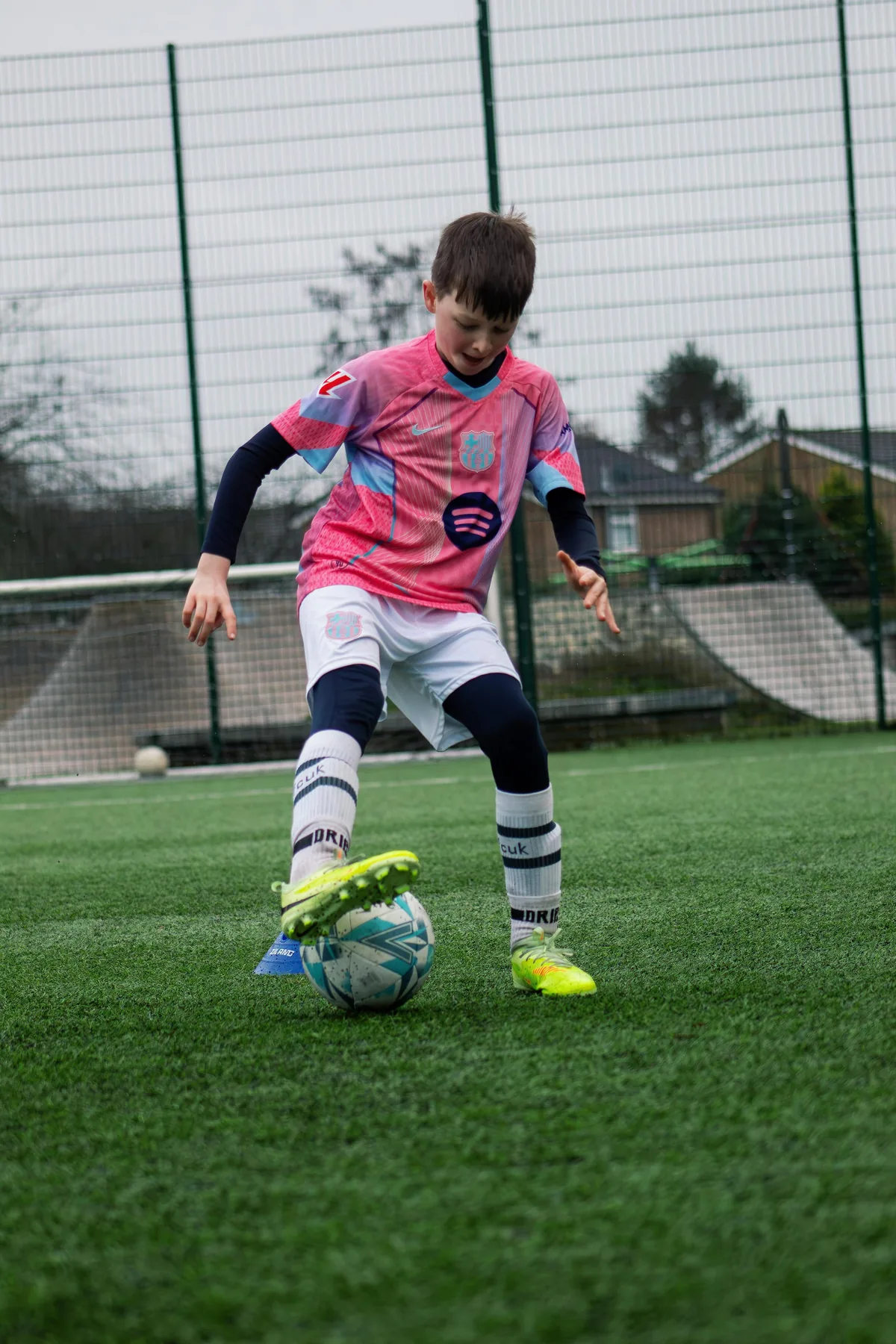 A young player working on close control